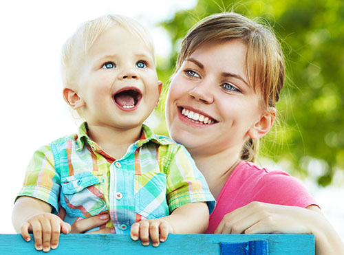 Smiling toddler with mom